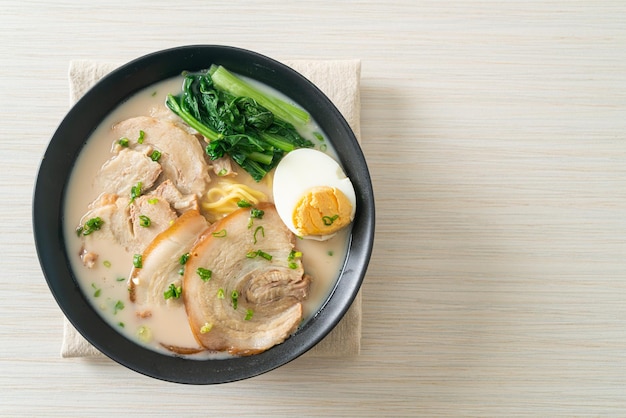 Ramen noodles in pork bone soup with roast pork and egg or Tonkotsu ramen noodles - Japanese food style