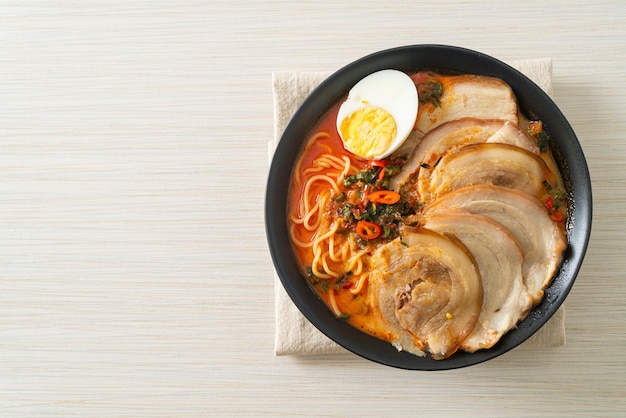 Ramen Noodles Spicy Tomyum Soup with Roast Pork - Fusion food style