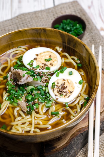 Ramen noodles with eggs, meat and green onion