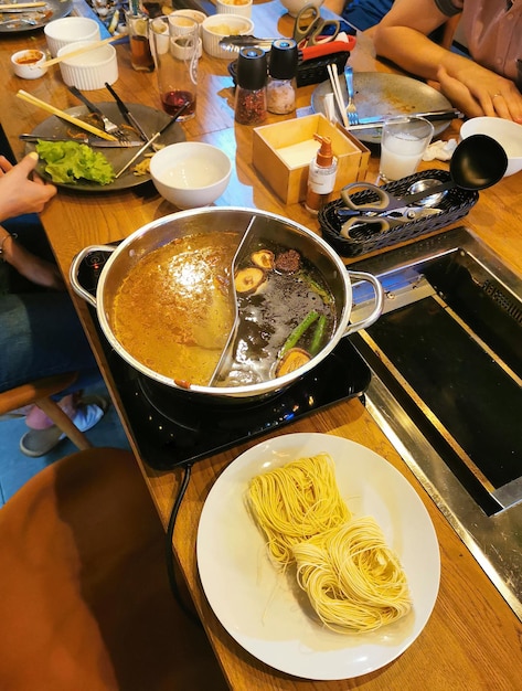 Ramen with noodles and mushrooms in a restaurant Meeting friends in a Chinese restaurant