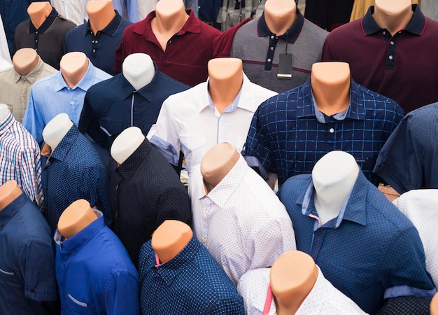 The range of men's shirts on mannequins in the market selective focus