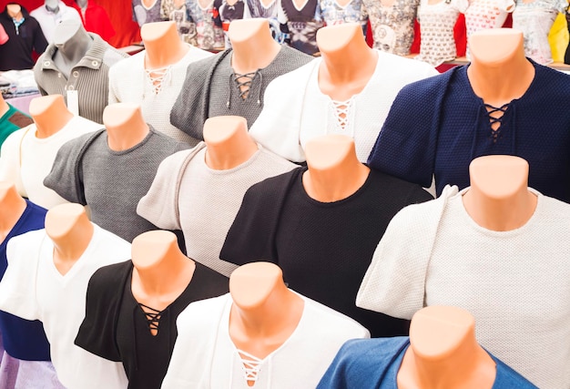 The range of men's sweaters on mannequins in the market selective focus