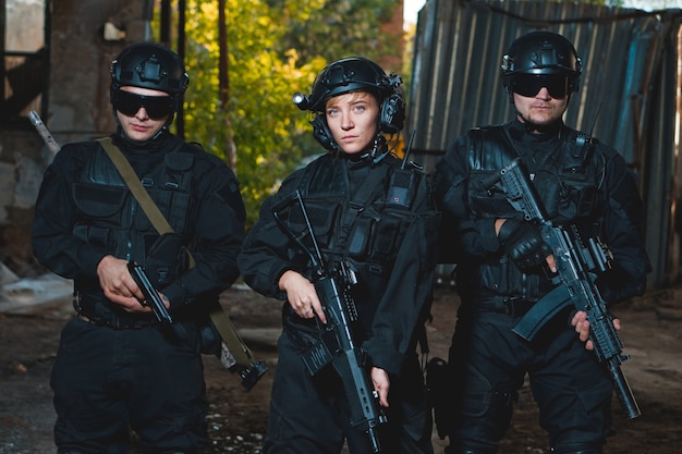 Rangers in black uniforms with guns