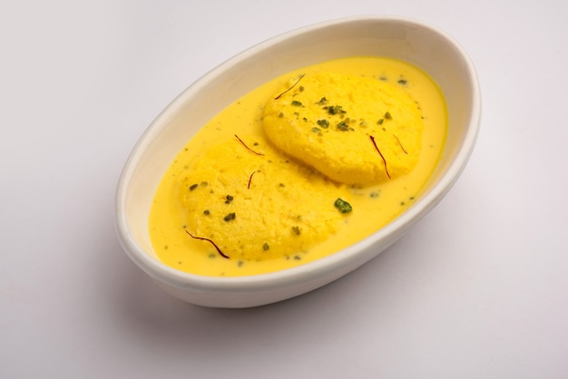 Ras malai or Royal Rossomalai is a dessert from Bengal, India. It's a a rich cheesecake without a crust, with Saffron or Kesar & Pistachio toppings