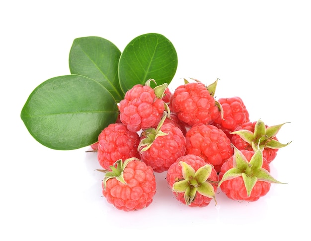 Raspberries with green leaf isolated on white background