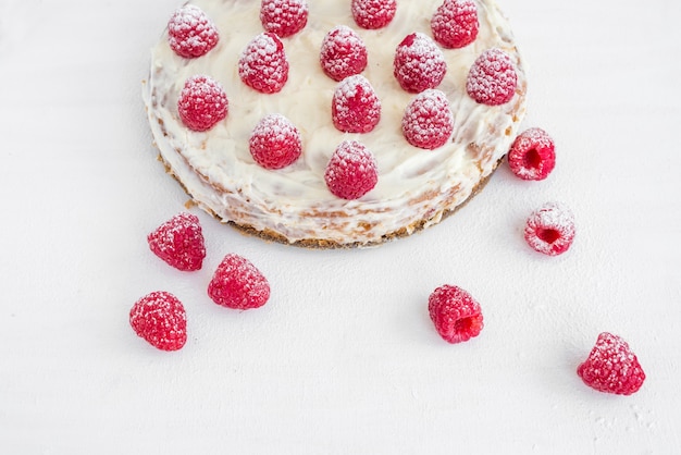 Raspberry cake on a white table