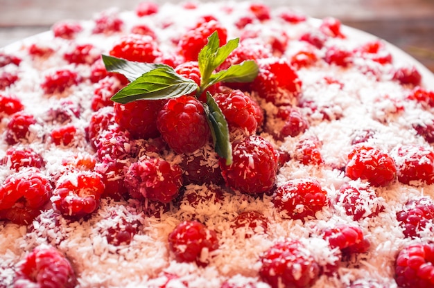 Raspberry cheesecake with mint closeup