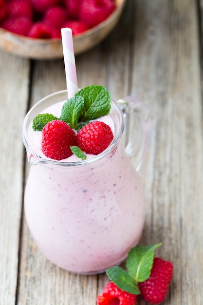 Raspberry milk shake with mint decor.