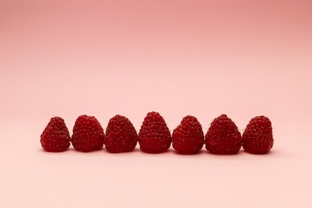 Raspberry on a pink background