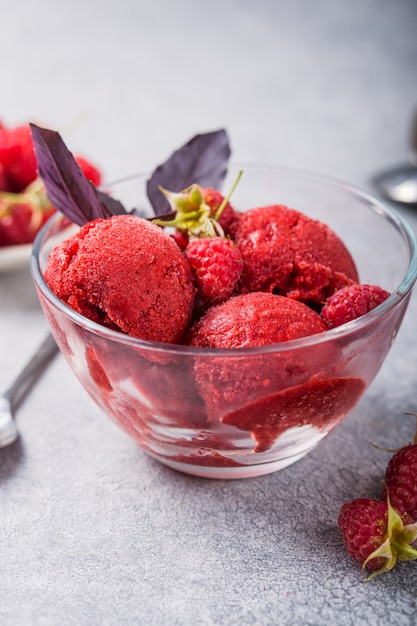 Raspberry sorbet ice cream in a glass bowl