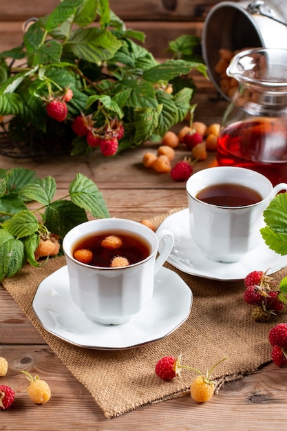 Raspberry tea with natural berries on wooden table vitamin tea for weight loss