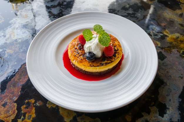 Rassberry pancakes with jam on plate