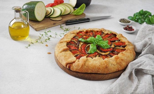 Ratatouille galette pie on light table ingredients vegetarian