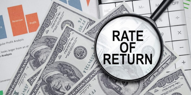 RATE OF RETURN words on magnifier glass with dollars and charts