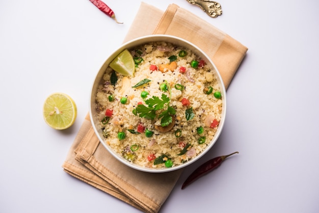 Rava Upma or Uppuma - south indian breakfast served in a bowl. selective focus