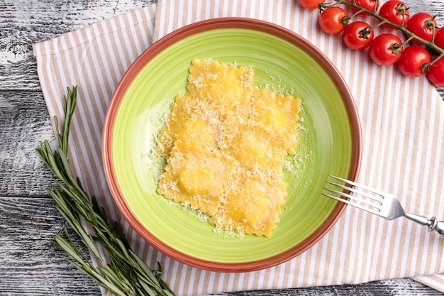 Ravioli italian ravioli on a white wooden background top view