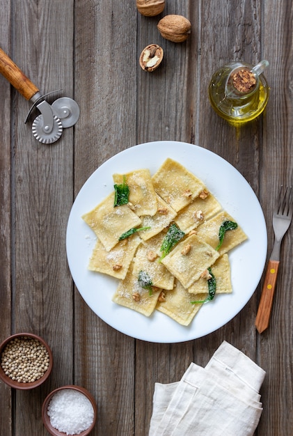 Ravioli with ricotta cheese, spinach and nuts. Healthy eating. Vegetarian food. Italian cuisine.