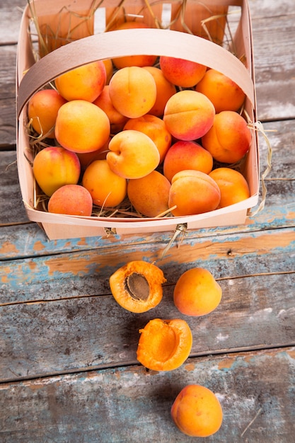 Raw apricot in basket