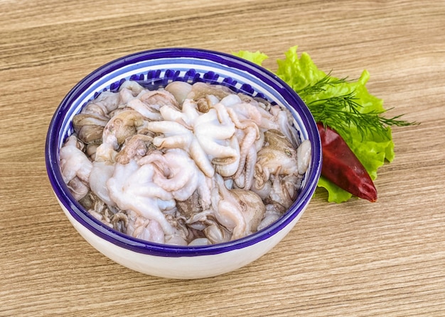 Raw baby octopus in the bowl ready for cooking