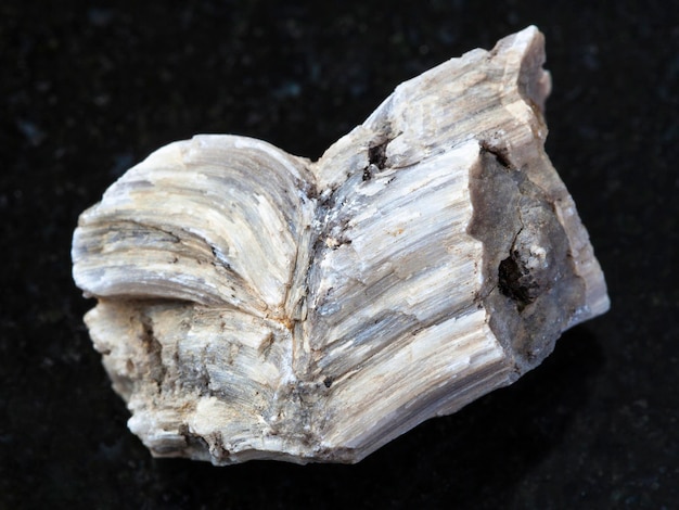 Raw baryte stone on dark background