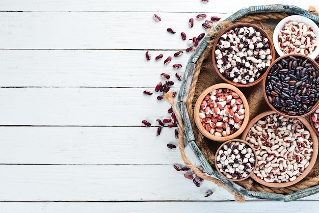 Raw beans in a wooden box Top view Free copy space