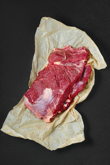 Raw beef neck on wrapping paper