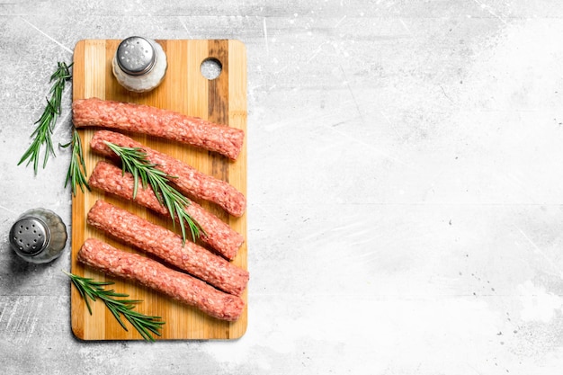 Raw beef sausages with herbs