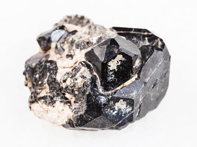 Raw black crystal of Spinel gemstone on Diopside