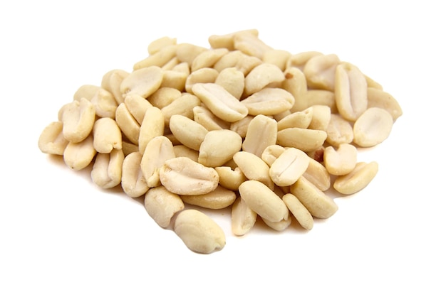 Raw blanched peanuts isolated on white background