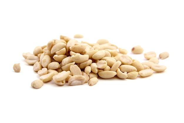 Raw blanched peanuts isolated on white background