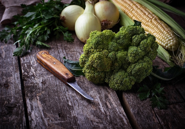 Raw broccoli, onions and corn. Selective focus