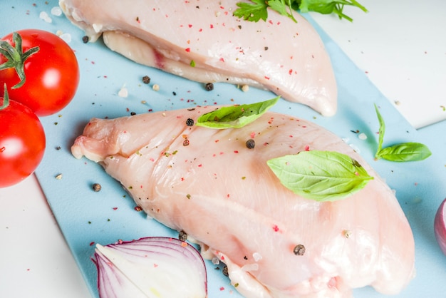 Raw chicken fillet with spices and herbs 