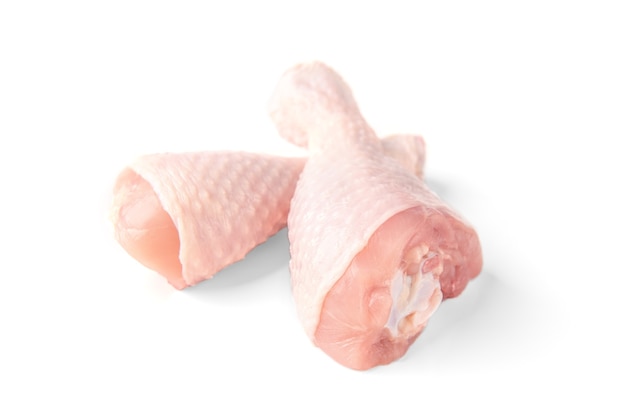 Raw chicken legs isolated on white.