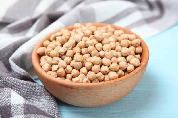 Raw chickpeas on the table on a light background closeup