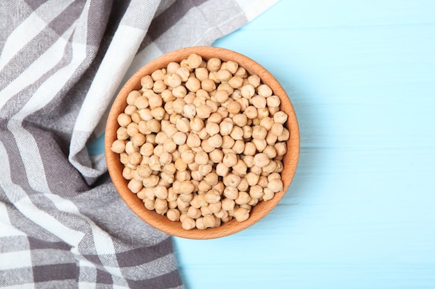 Raw chickpeas on the table on a light background closeup