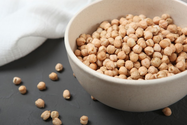 Raw chickpeas on the table on a light background closeup