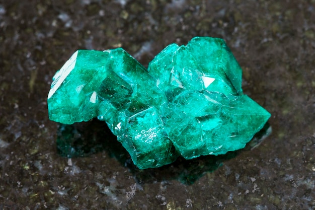 Raw Dioptase crystal of gemstone on dark