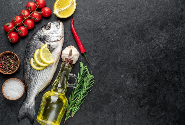 raw dorado fish on stone table