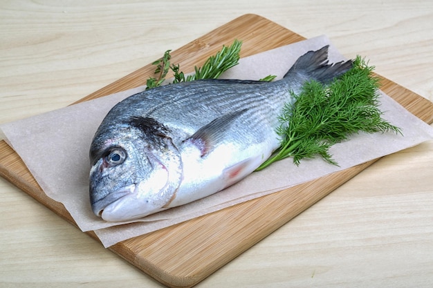 Raw dorado fish with dill rosemary and thyme