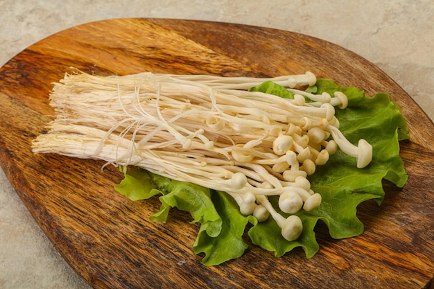 Raw Enoki mushrooms for cooking