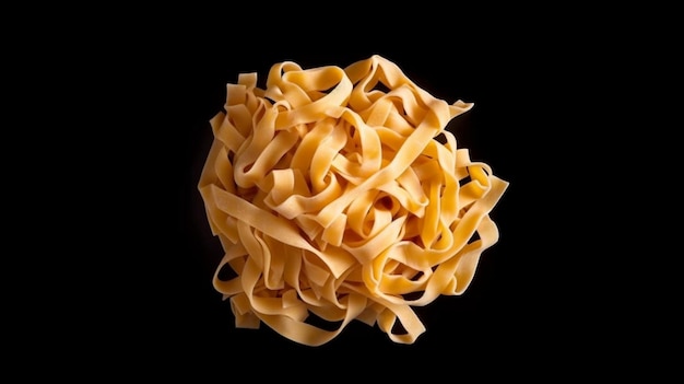 raw fettuccine pasta isolated on black background