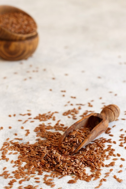 Raw Flax seeds with a scoop close up