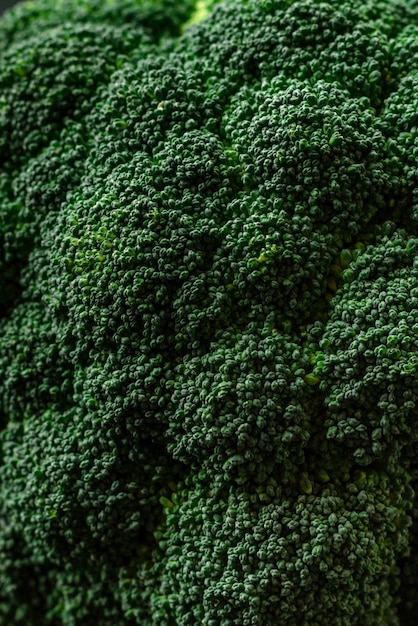 Raw fresh broccoli on a black home kitchen table