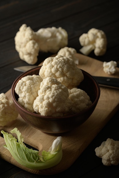 Raw fresh organic cauliflower on a wooden background Healthy eating low carb diet concept