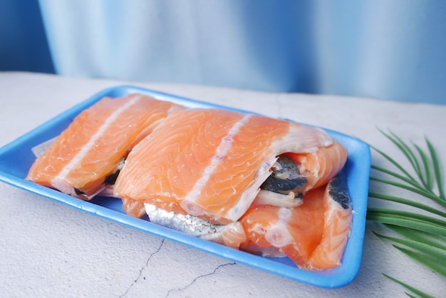 Raw fresh salmon steak on a plastic packet on table