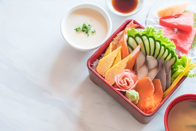 Raw fresh sashimi with rice in bento box