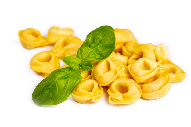 Raw fresh tortellini pasta isolated on white background