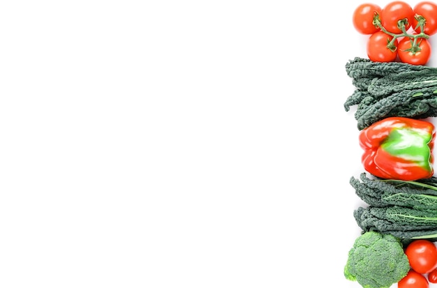 Raw healthy food clean eating vegetables source of protein for vegetarians broccoli bellpepper kale tomato Fresh colorful organic vegetables captured from above banner copy space