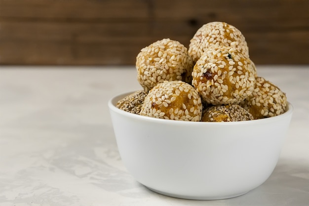 Raw healthy vegetarian snack. Organic bites with dried apricots, dates, cashews and honey