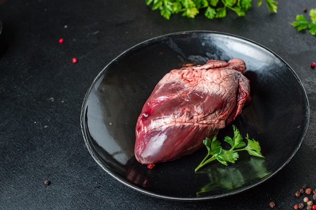 raw heart offal pork or beef meat food on the table